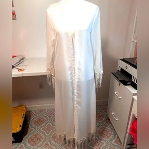 Sheer breezy white cover. Wear at home, work, or pool. Beautiful Fringe small
